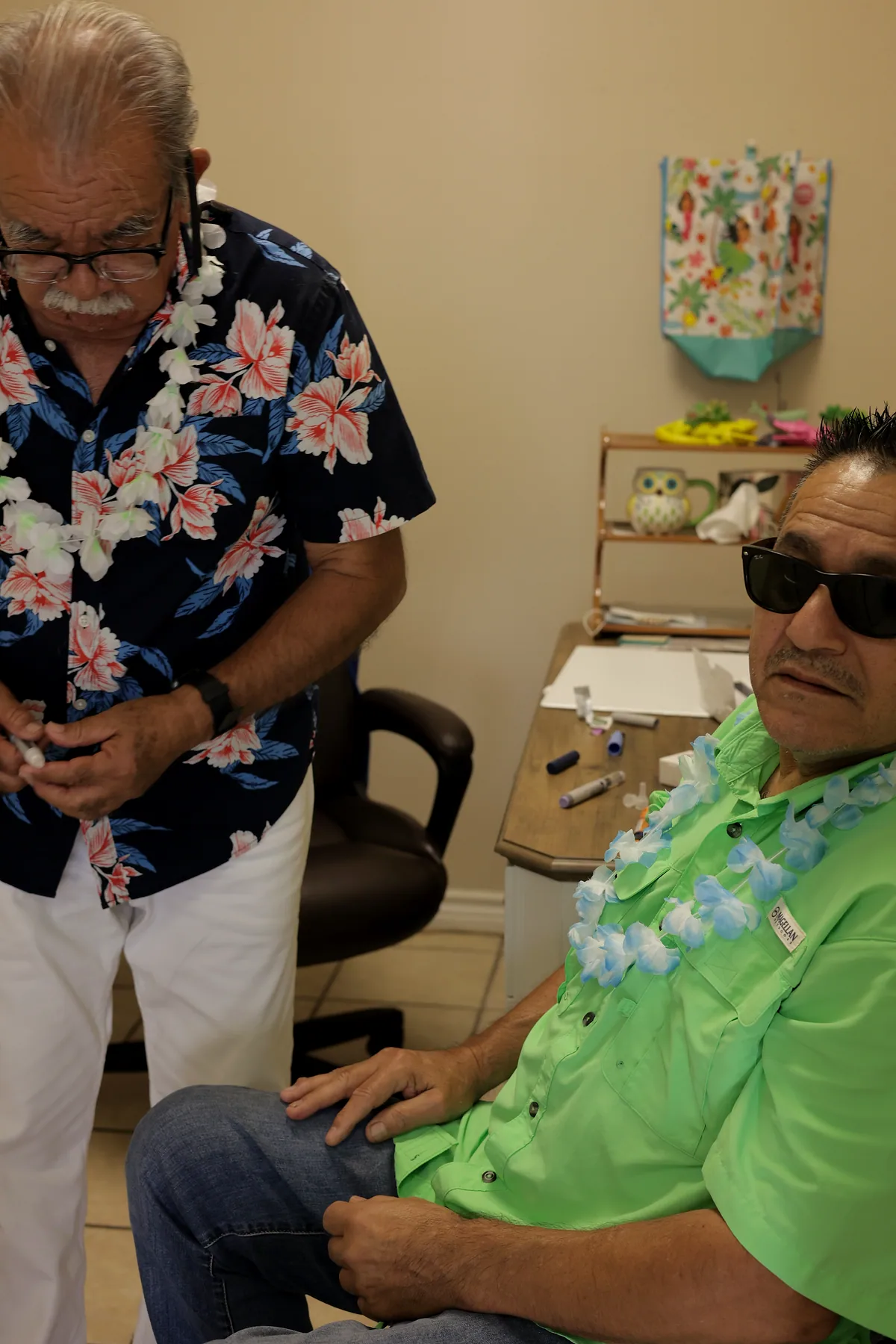 A staff member administering medication to a participant at the center